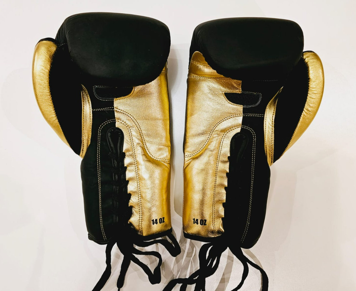 gold and black boxing gloves