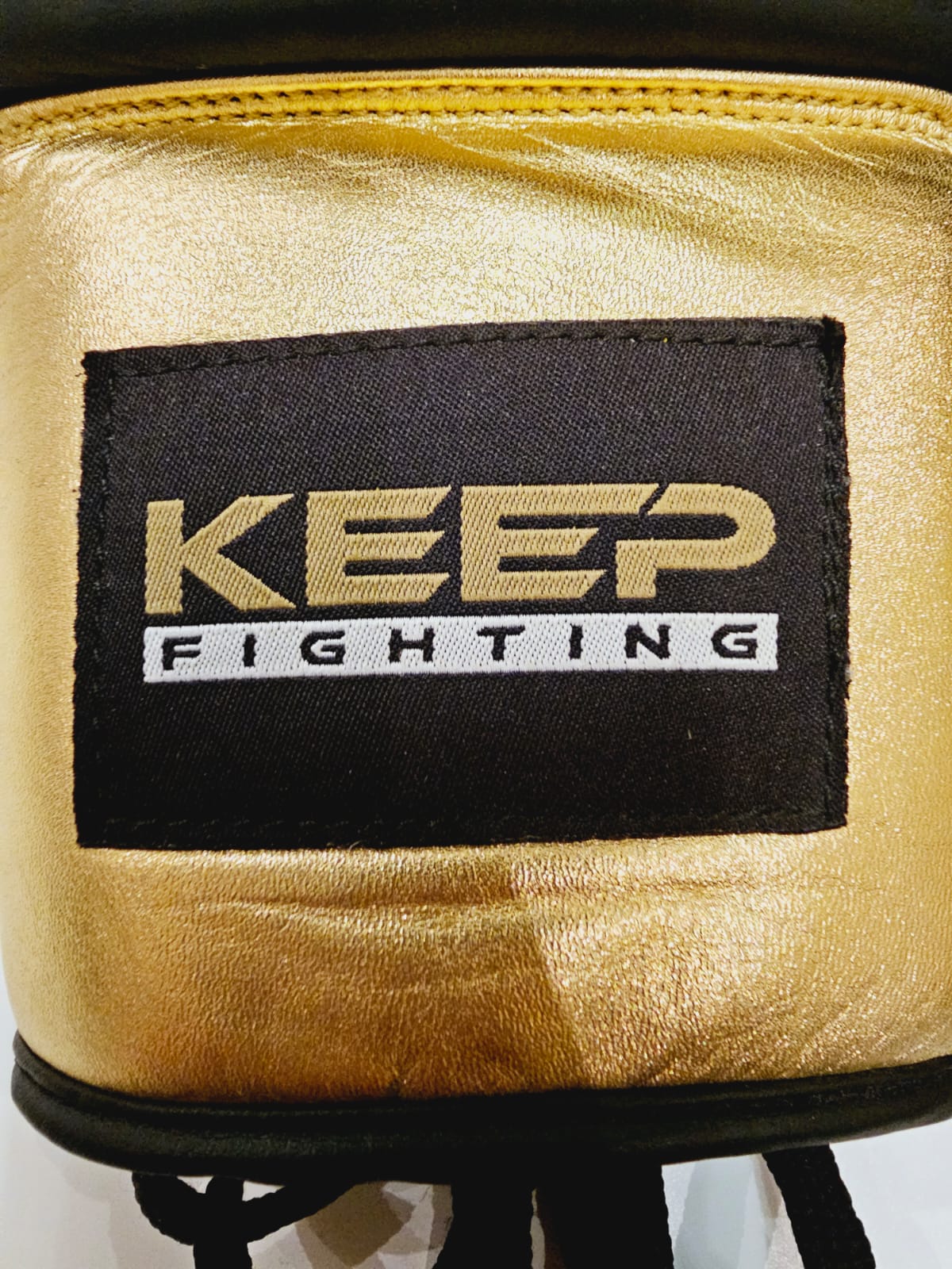 gold and black gloves